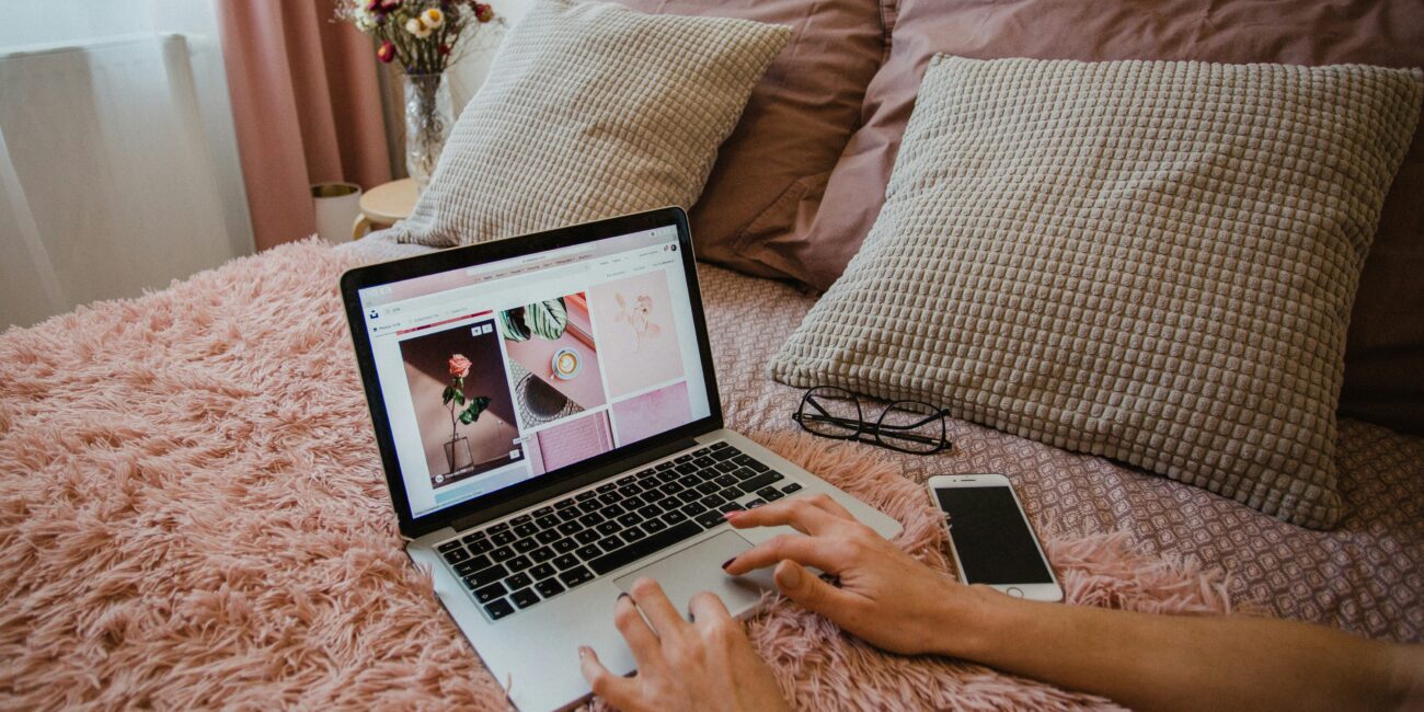 computer on pink blanket